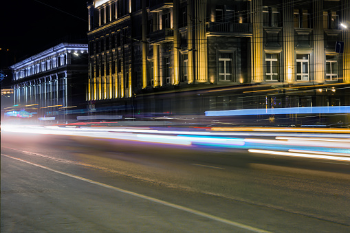 Car traffic at night on a city street. Blurred motion.