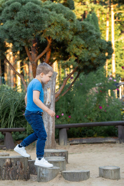 istock A little boy in a stump obstacle course 1950937875