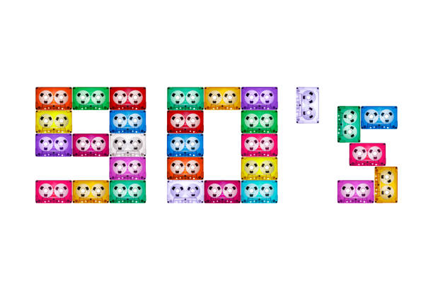 Square form text 90's on a white isolated background, composed of ancient, different, colorful audio cassettes. The year of nostalgia for analog home audio technology of the 1990s.