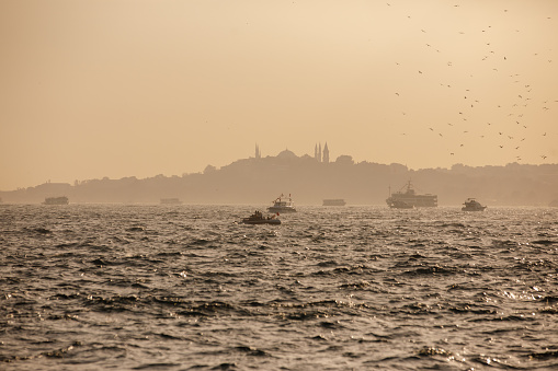Modern and Big Warships Crossing the Bosphorus with Istanbul Skyline in Istanbul, Turkey