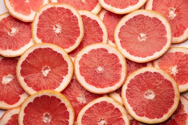 istock top down background view made of Fresh Sliced organic grapefruit close-up 1951037459