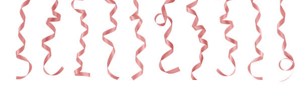 istock Rose gold pink ribbon satin bow confetti hanging scroll set isolated on white background with clipping path for Christmas and wedding card design decoration element 1951048522