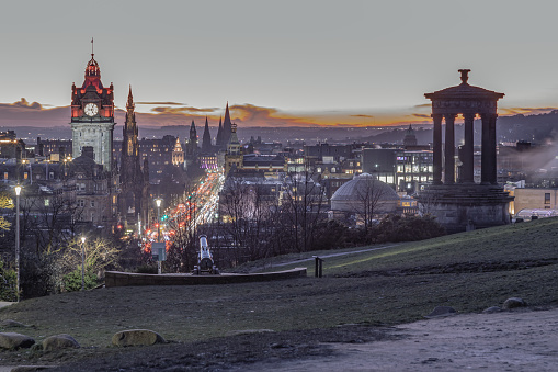 Edinburgh, Scotland - Jan 18, 2024 - Aerial view at dusk of the Royal Mile or High Street in Edinburgh Old Town from the hilltop of Calton Hill in central Edinburgh. Destinations in Europe, Space for text, Selective focus.