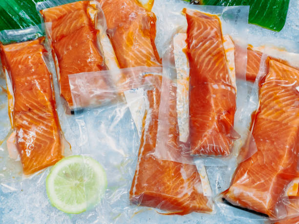 istock Fresh Salmon Meat In Vacuum Plastic Wrap 1951064158