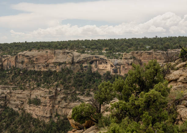 istock Balcony House Hides Below The Forest Covered Rim 1951070037