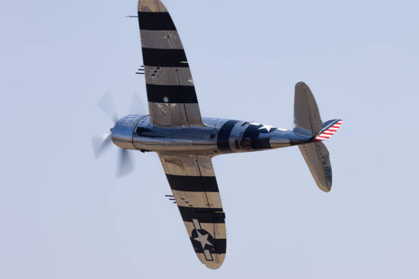 istock P-47G Thunderbolt (WWII American fighter plane) with  its “Invasion Stripes”, in a turn 1951081346