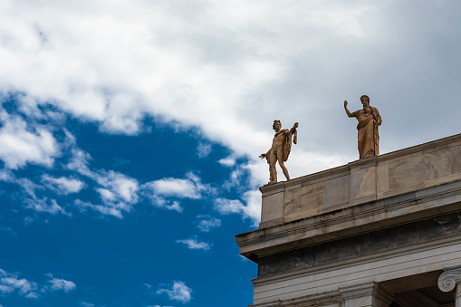 Photo of statues above the museum in Athens, Greece