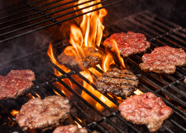 istock Beef hamburger patties cooking on the grill. 1951164464