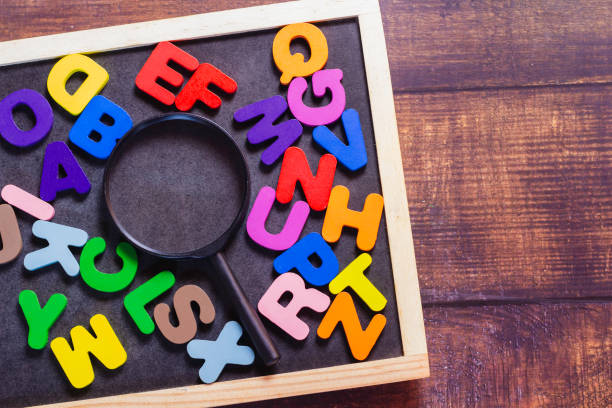 istock English letters scattered on a black background 1951166071