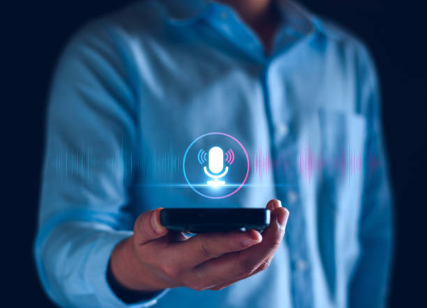 istock Voice recording. Man touching microphone icon on smart phone. Mobile application Record sound, audio, music, voice message. or Use your voice to direct AI to search for information on Internet. 1951234236