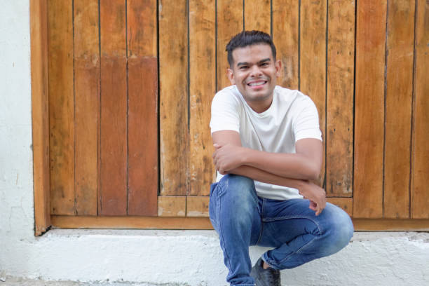 istock Smiling Man with Braces Sitting 1951294611