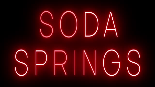 Glowing and blinking red retro neon sign for SODA SPRINGS