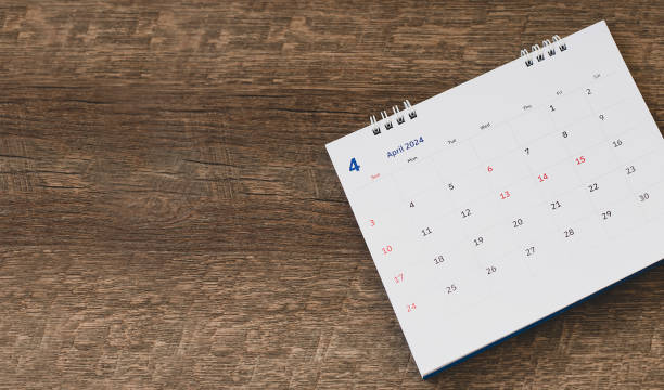 istock White desk calendar on a brown wooden table 1951384468