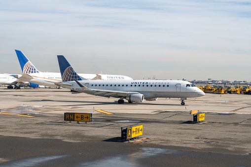 March 1, 2023 - Newark, New Jersey, USA - A united airlines Embrear 175 Commuter jet operated by Republic Airways on the runway at EWR Newark Liberty International Airport