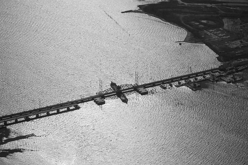 Aerial view of the Raritan Bay Drawbridge aka River-Draw, Raritan Bay Swing Bridge, Raritan River Railroad Bridge a swing draw. train bridge across the Raritan Bay operated by New Jersey Transit