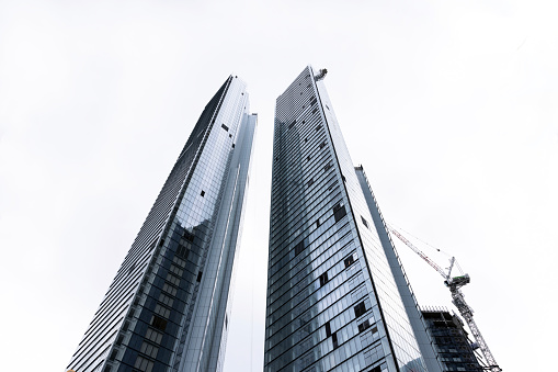 Low angle view of modern office buildings skyscrapers, Sydney, white background with copy space, full frame horizontal composition