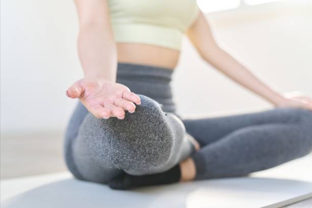 istock Hands of a meditating woman 1951505459