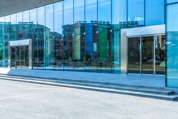 istock empty asphalt road front of modern buildings 1951529423