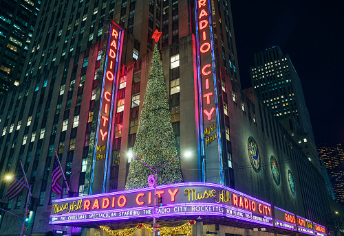 New York City, New York, USA - December 01, 2023: Night shot of the Radio City Music Hall. Which is one of the most famous theaters in the world is an entertainment venue located in New York City's Rockefeller Center.