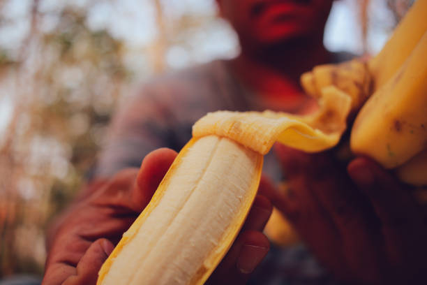 Men Eating Banana