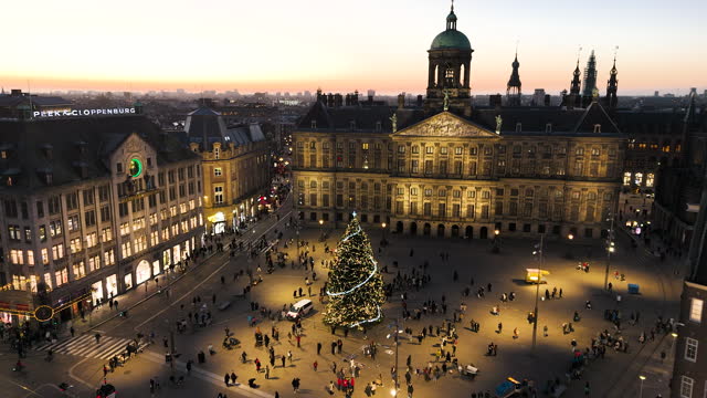 Amsterdam City Center National Monument, Royal Palace Amsterdam, Dam square in Amsterdam at christmas time at sunset, Aerial view of Dam square and royal palace in Amsterdam