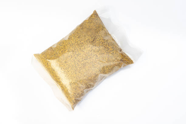istock Mustard cake powder fertilizer on white background 1951611511