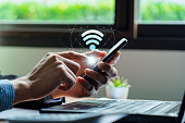 Wifi internet access concept, Business people connect WiFi technology. connect instantly via smartphone and high-speed hotspot. Fast internet wifi hotspot sharing. Working with various applications