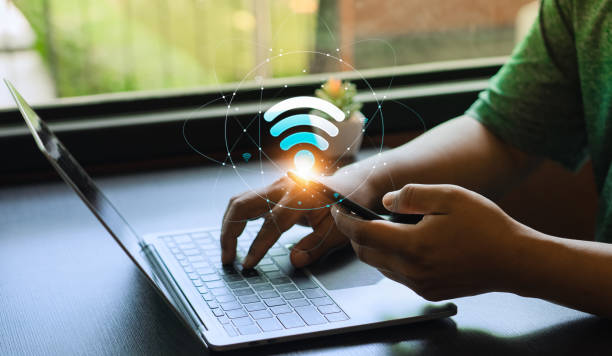 istock Wifi internet access concept, Business people connect WiFi technology. connect instantly via smartphone and high-speed hotspot. Fast internet wifi hotspot sharing. Working with various applications 1951614628