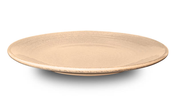istock Brown circle ceramics plate isolated on white background. 1951628872