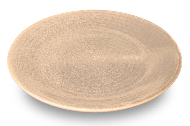 istock Brown circle ceramics plate isolated on white background. 1951629375