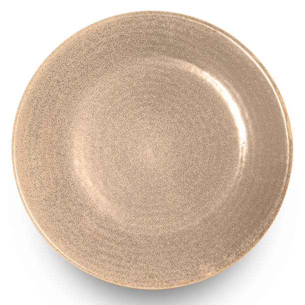 istock Brown circle ceramics plate isolated on white background. 1951629380