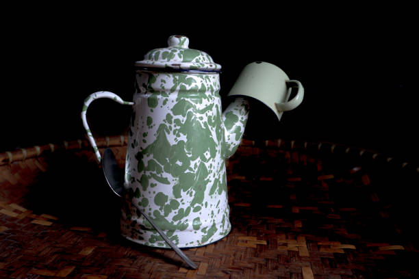 istock The enamel teapot and mug sit on a woven bamboo base 1951670924