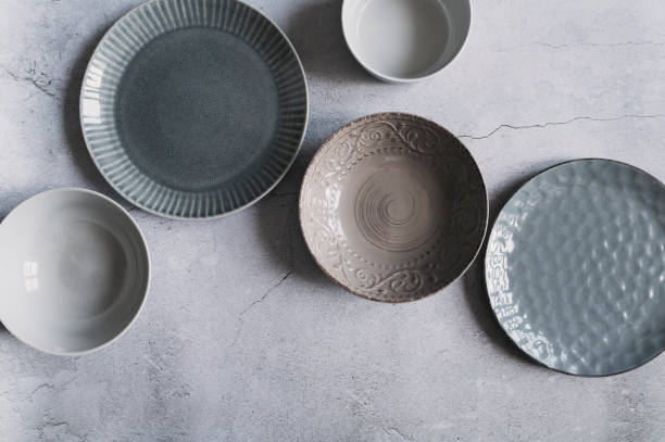 istock modern dishware collection in rustic grey and beige tones. Trendy ceramic plates. 1951678666