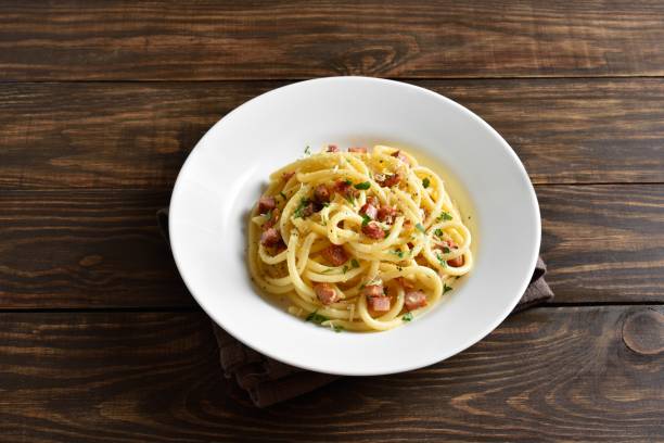 istock Carbonara pasta, spaghetti with crisp pancetta and black pepper 1951711172