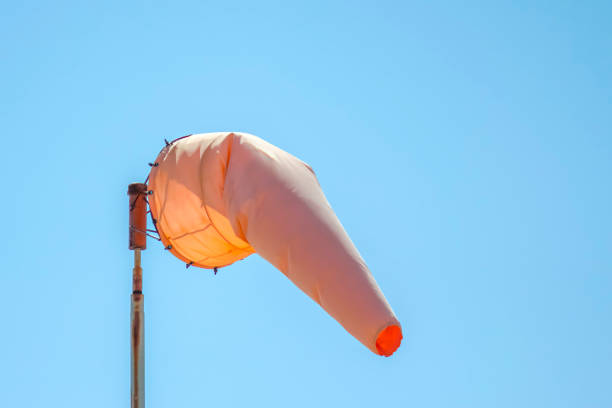 A windsock (a wind cone or wind sleeve) a conical textile tube that resembles a giant sock, used as a basic indicator of wind speed and direction.