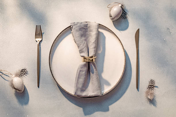 istock Easter table setting on gray background. Holiday decoration with copy space 1951725639