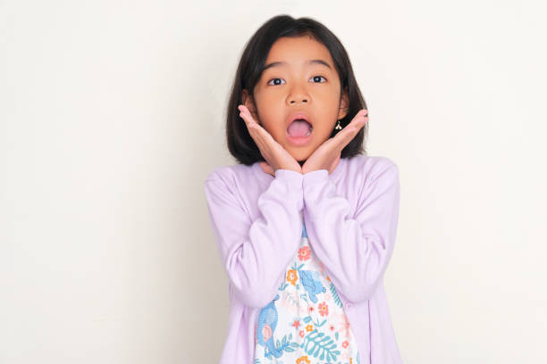 istock Asian kid showing shocked face expression while looking to the camera 1951749013