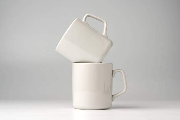 istock Blank white mugs mock up on white background 1951775815