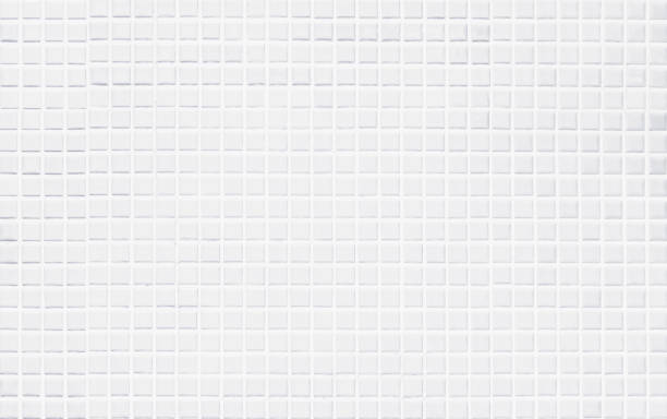 istock White tile wall chequered background bathroom texture. Ceramic brick wall and floor tiles mosaic background in bathroom and kitchen clean. Design pattern geometric with grid wallpaper floor elements. 1951776859