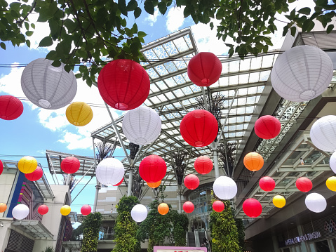 Bekasi, Indonesia -  January 19 2024: An outdoor dining table in a shopping center decorated with lanterns is suitable for relaxing with friends or family