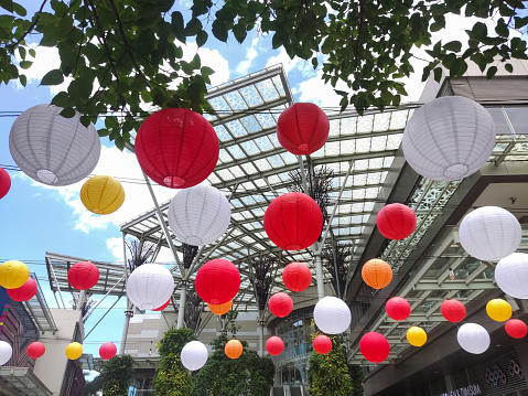 Bekasi, Indonesia -  January 19 2024: An outdoor dining table in a shopping center decorated with lanterns is suitable for relaxing with friends or family