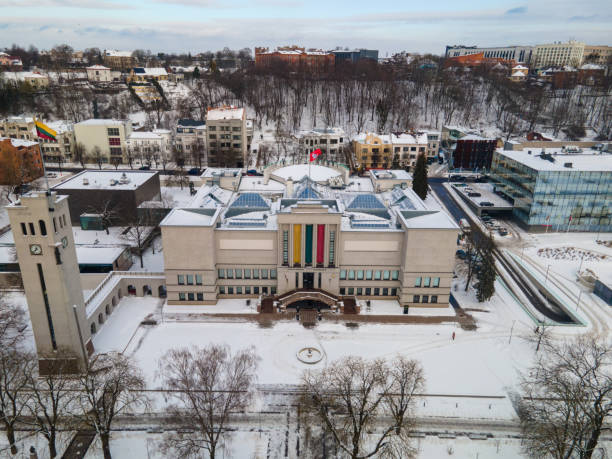 istock a large school in winter time, with trees lining the street 1951800120