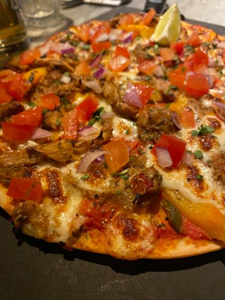 istock La Cubana Pizza Express Cheese Mozzarella Peppers Vegetables Tomato Sauce Marinara Dinner Food Tasty Delicious Pizzeria Pulled Pork Meat Gluten Free Celiac Coeliac Disease 1951804279