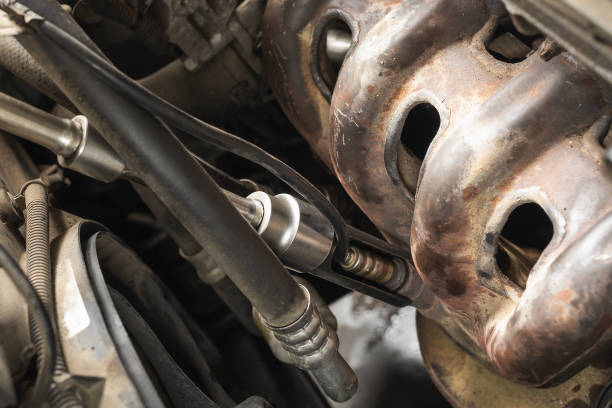 istock The workflow of screwing a car oxygen sensor on a car engine, close-up 1951817900