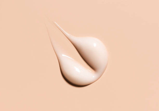 istock cosmetic smear texture on pastel beige background 1951834684