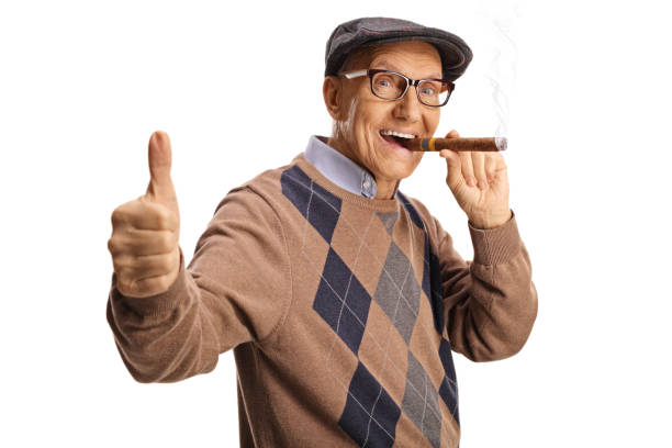 istock Senior man smoking a cigar and gesturing thumbs up 1951853278
