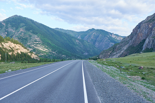 Asphalt road in the mountains. Altai, Siberia, Russia