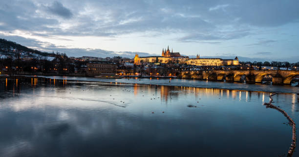 istock Prague city by the water at night 1951884147