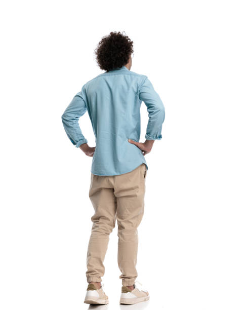 istock back view of casual man holding his hips 1951910075
