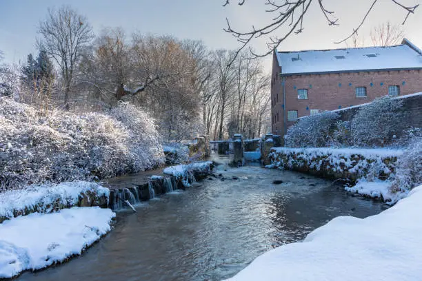 Photo of The Jeker, a river with a small rapid meandering through the valley of Jekerdal, just outside Maastricht during winter